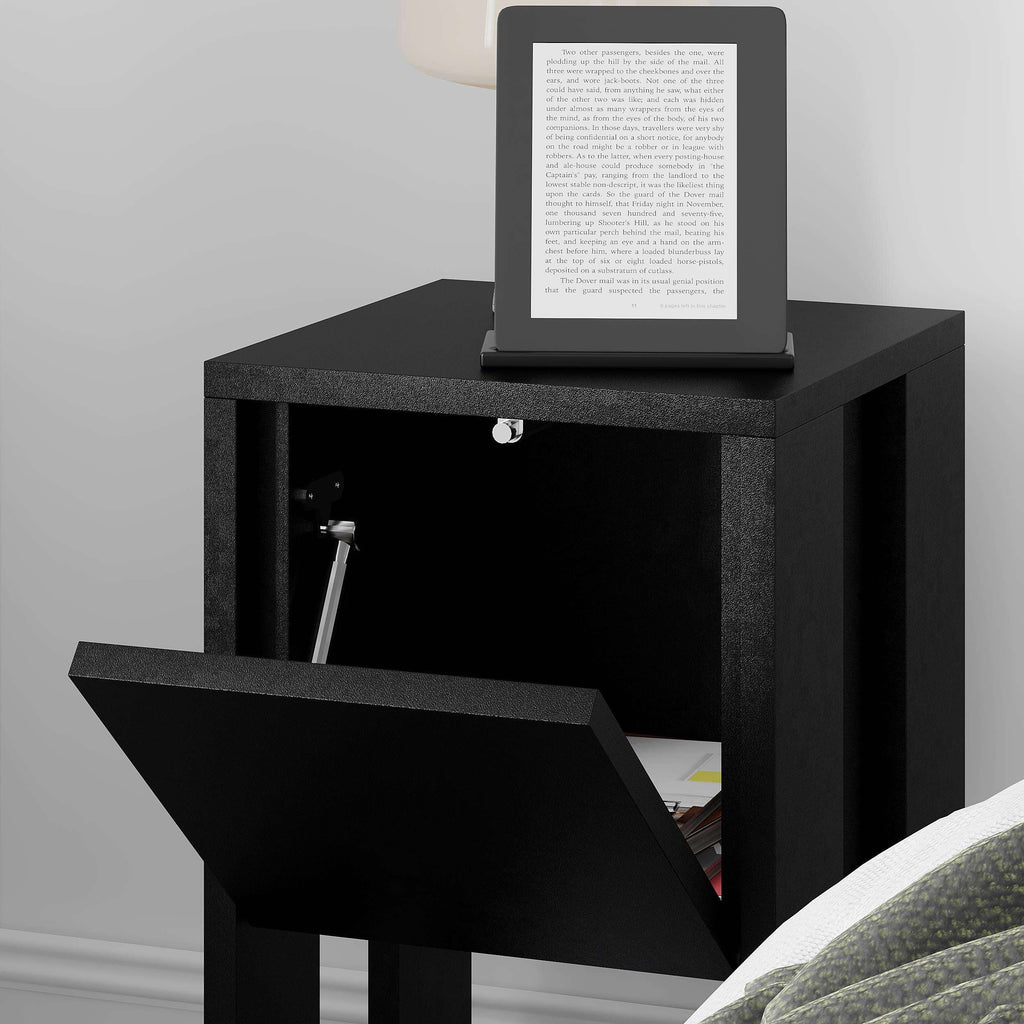 Black bedside table with open cabinet door and open lower shelf, tablet on top.