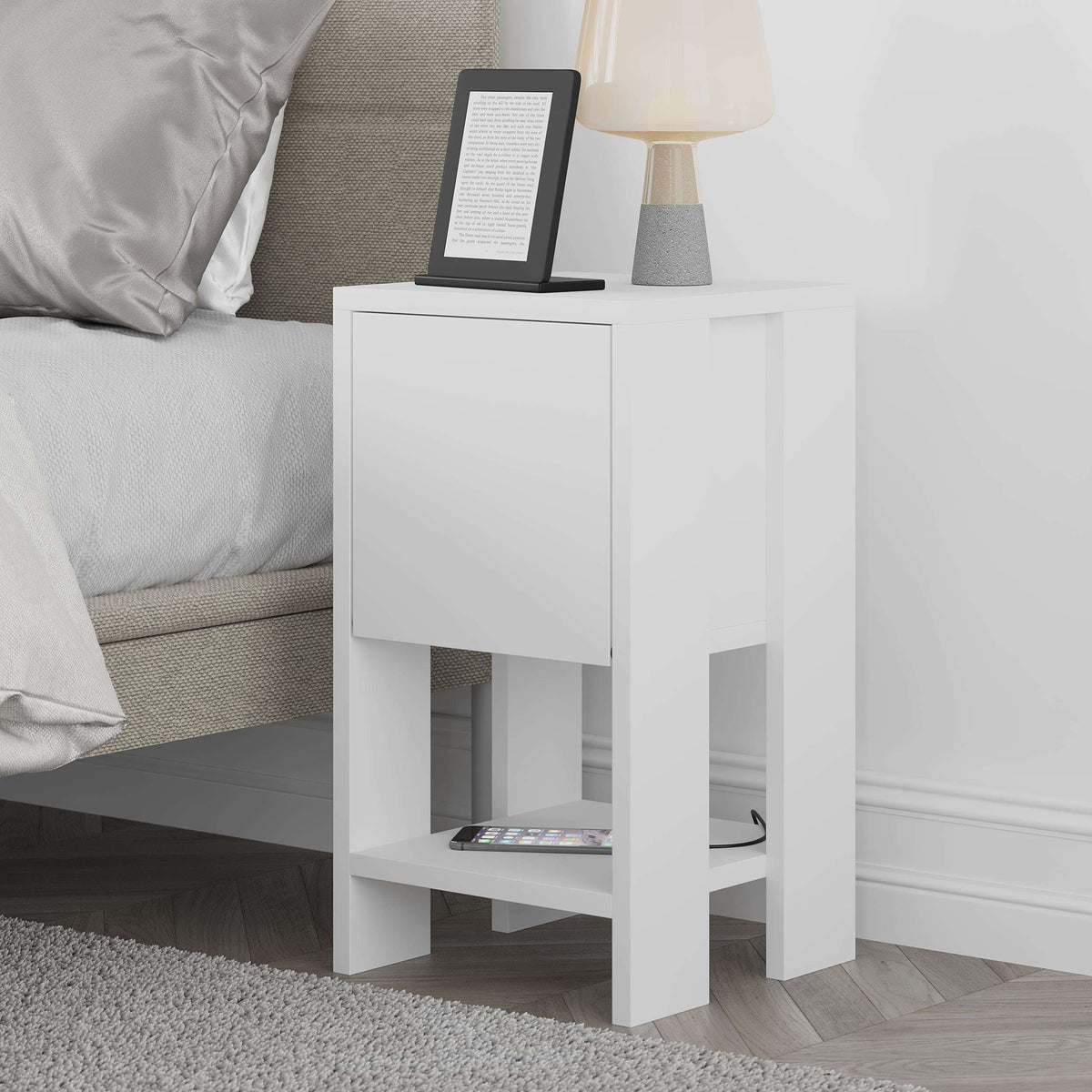 White bedside table with storage cabinet door and open lower shelf