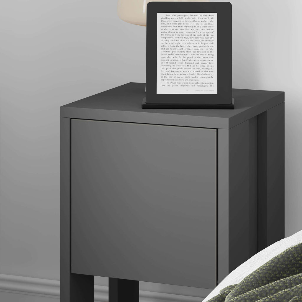 Modern bedside table with dark gray drawer panel and open bottom shelf