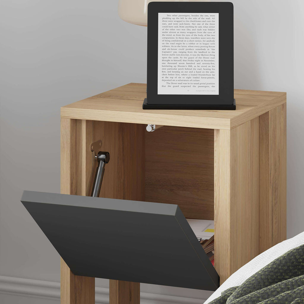 Modern bedside table with open drawer showing dark panel and oak interior