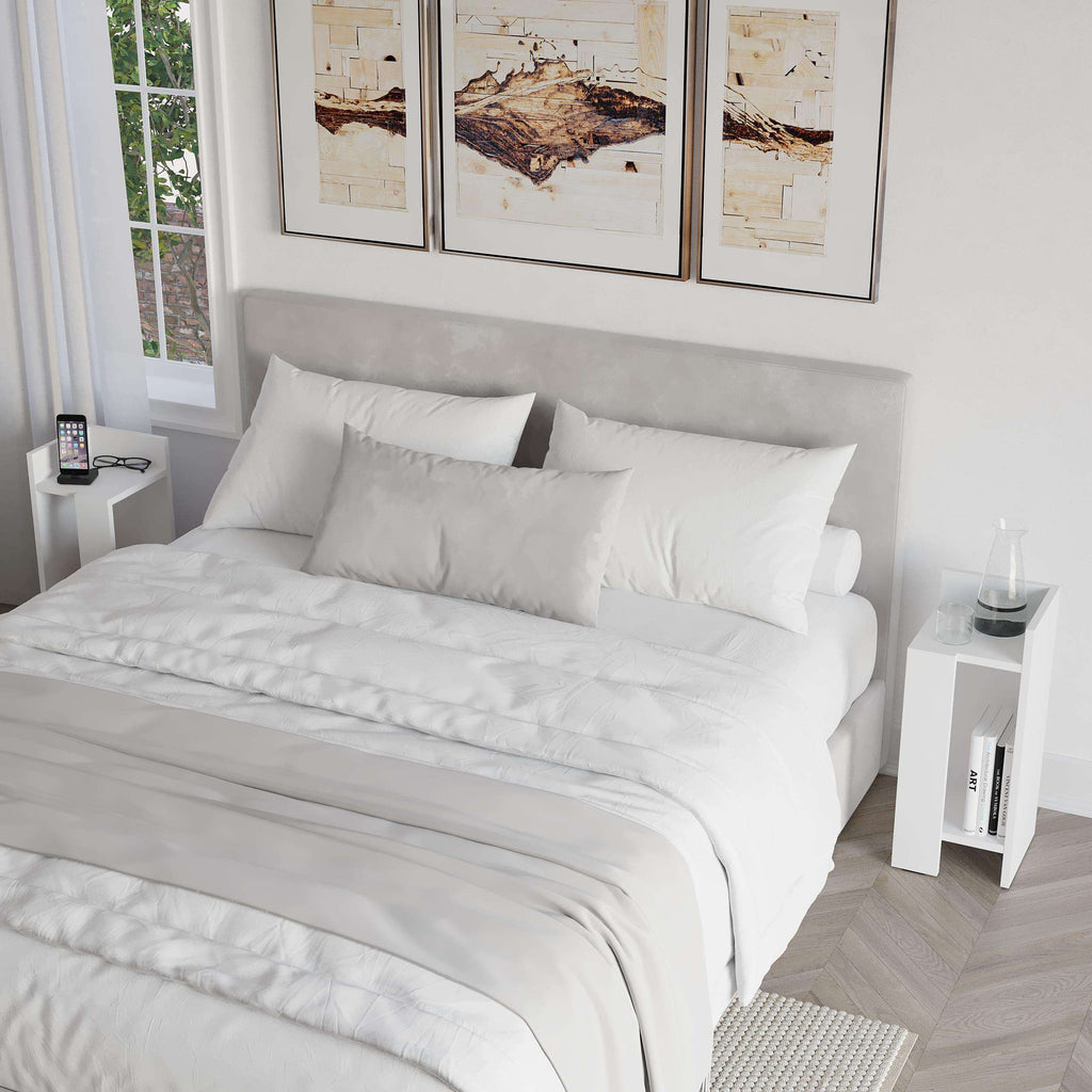 Narrow modern bedside table in white with open shelf and flat top