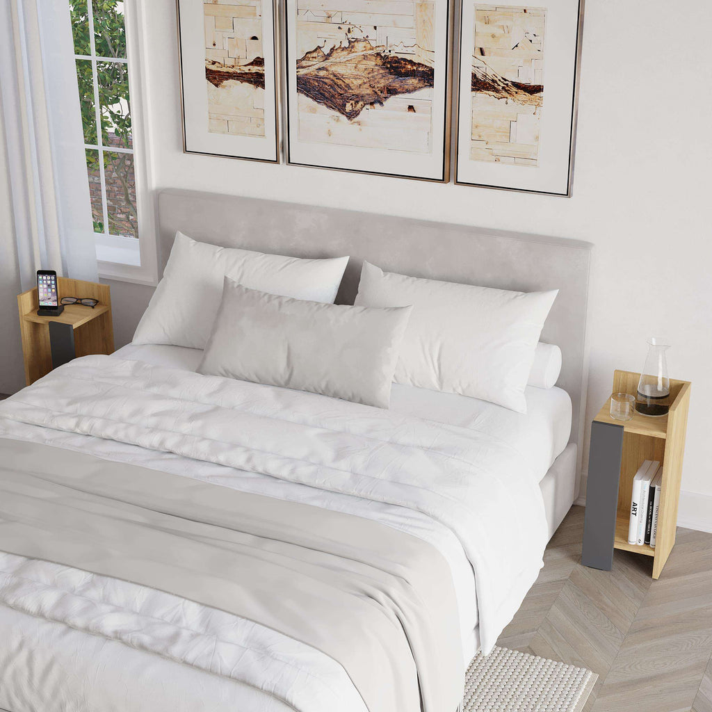 Narrow modern bedside table with light oak top and grey base, open shelf