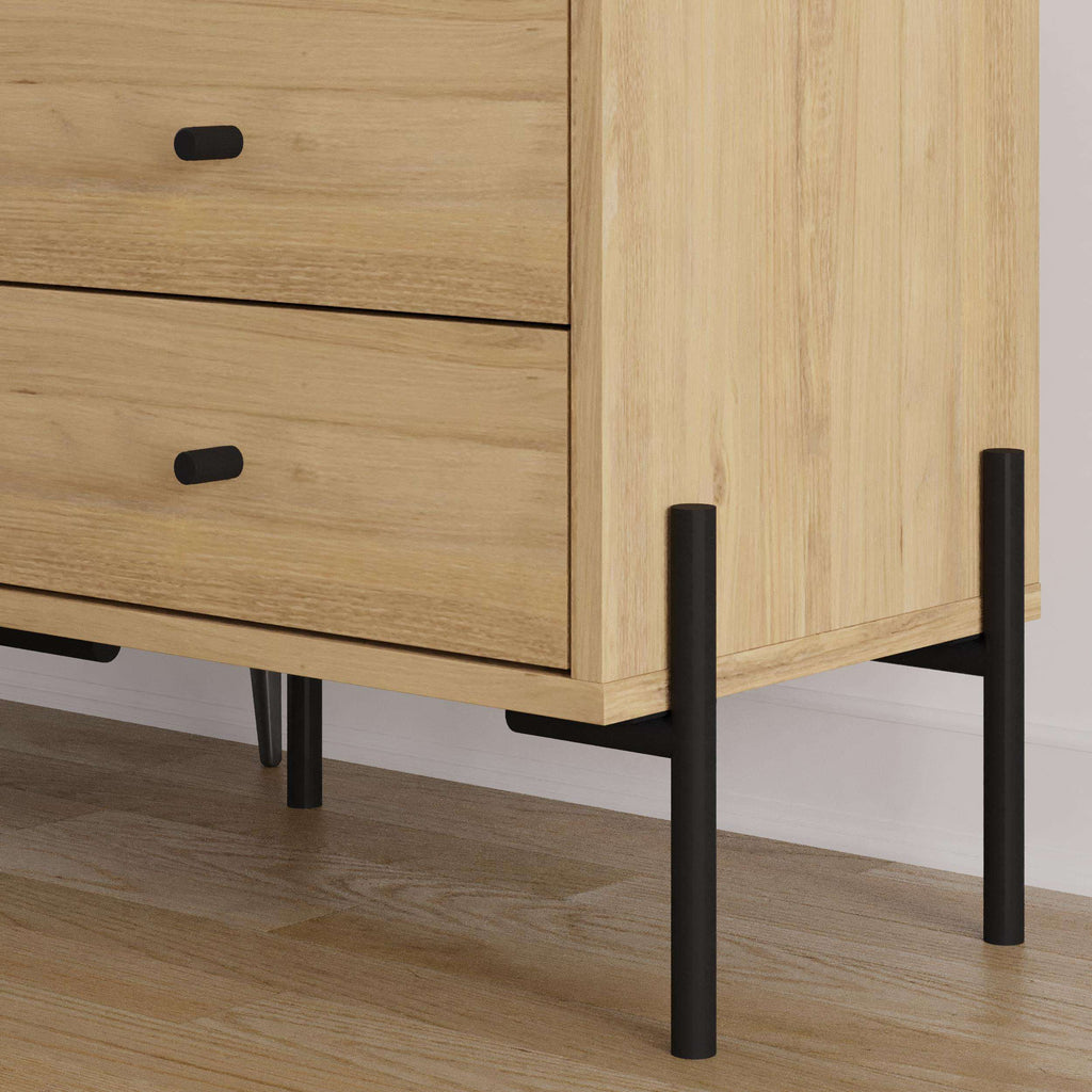 Bedside table corner detail with 2 drawers, light oak panels and black metal legs
