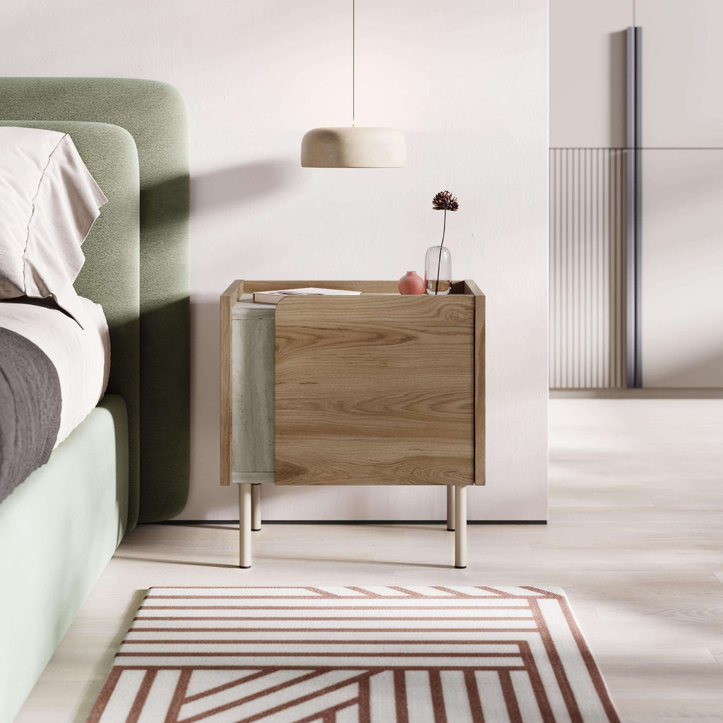 Modern bedside table with door open and natural oak finish, light metal legs