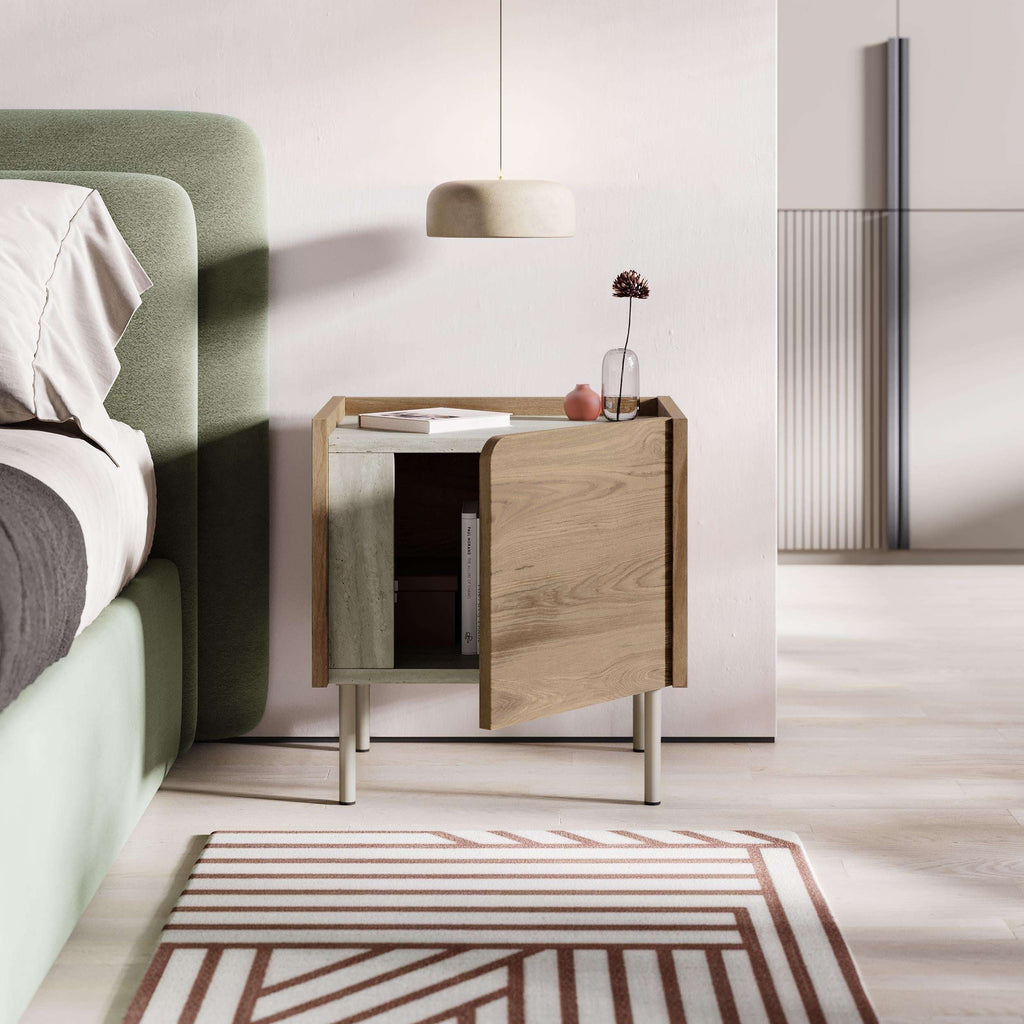 Modern bedside table with door open, natural oak finish and light metal legs