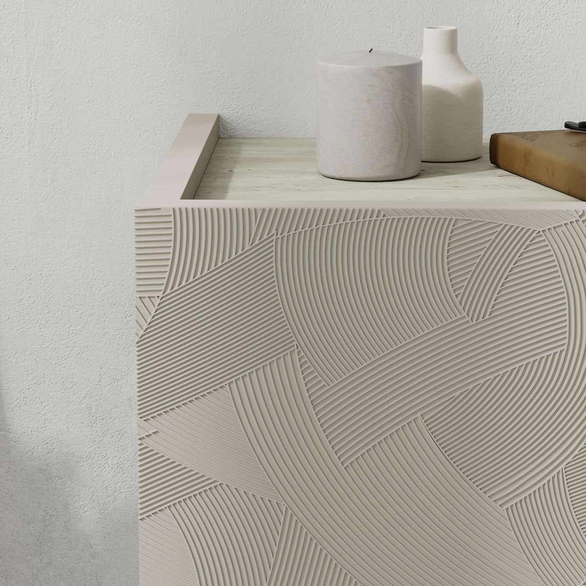 Wall-mounted nightstand drawer front detail, white textured geometric relief with horizontal lines