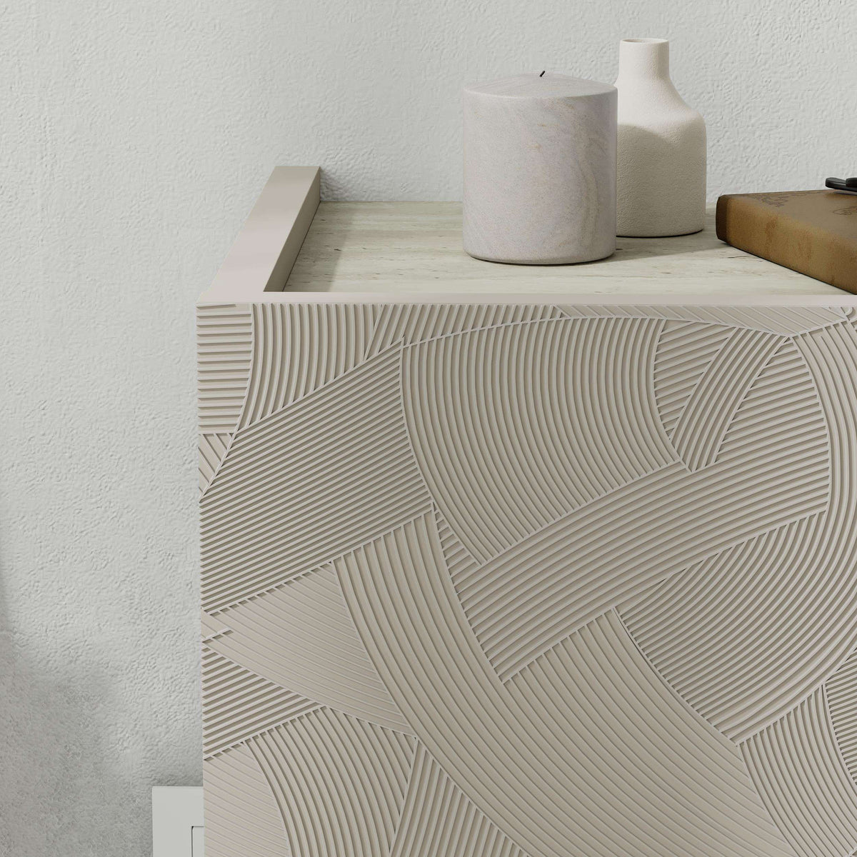 Wall-mounted nightstand drawer front with carved geometric pattern, light stone finish