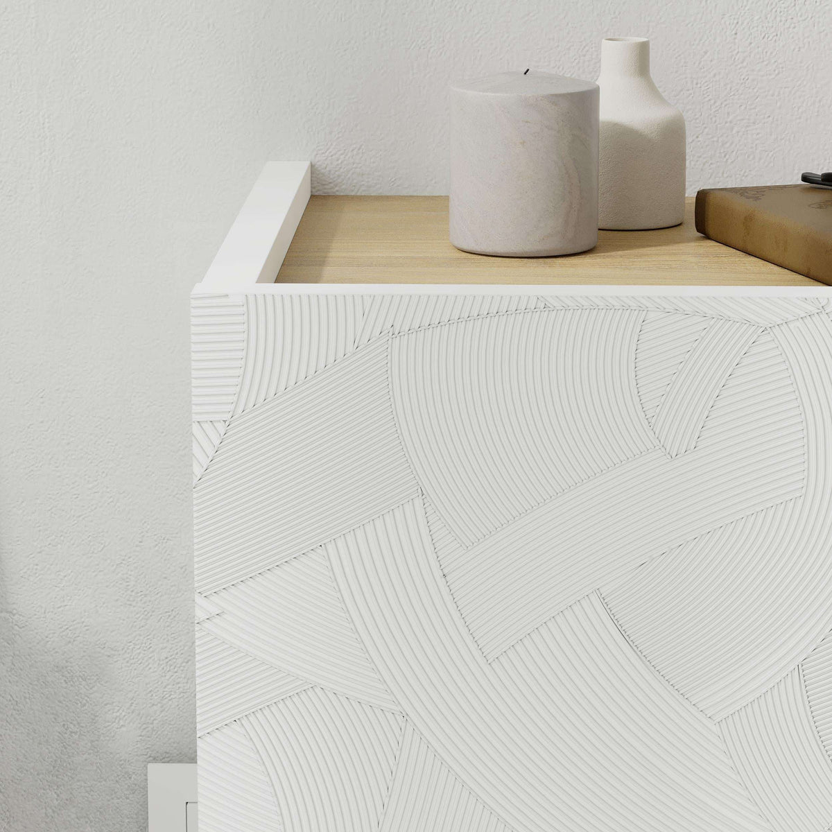 White wall-mounted nightstand drawer front with raised geometric pattern