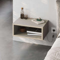 Floating wall-mounted bedside table with open shelf and light sand-colored cabinet