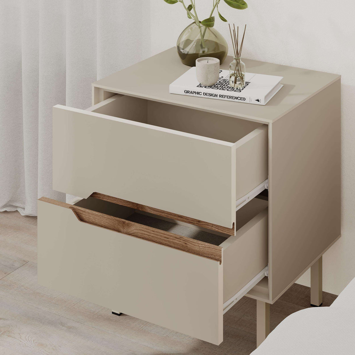 White bedside table with open drawer, warm wood handle and side shelf space