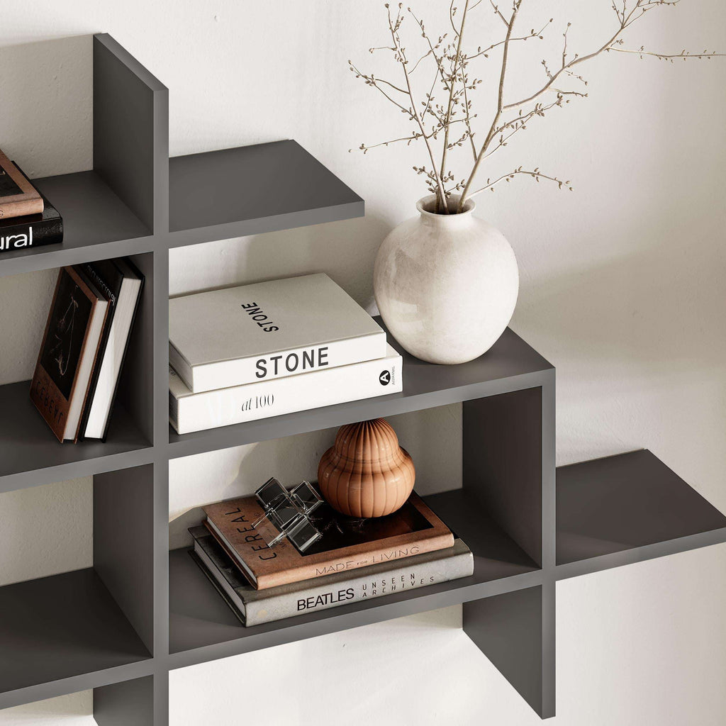 Anthracite wall-mounted bookcase with open cubby shelves and top ledge