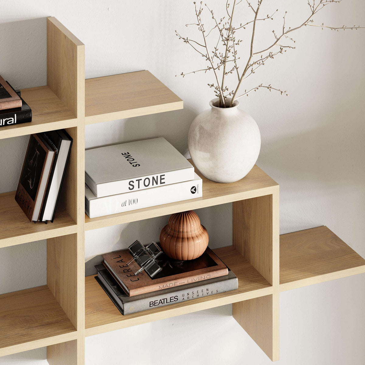 Light oak wall bookcase with open shelves and cubby compartments