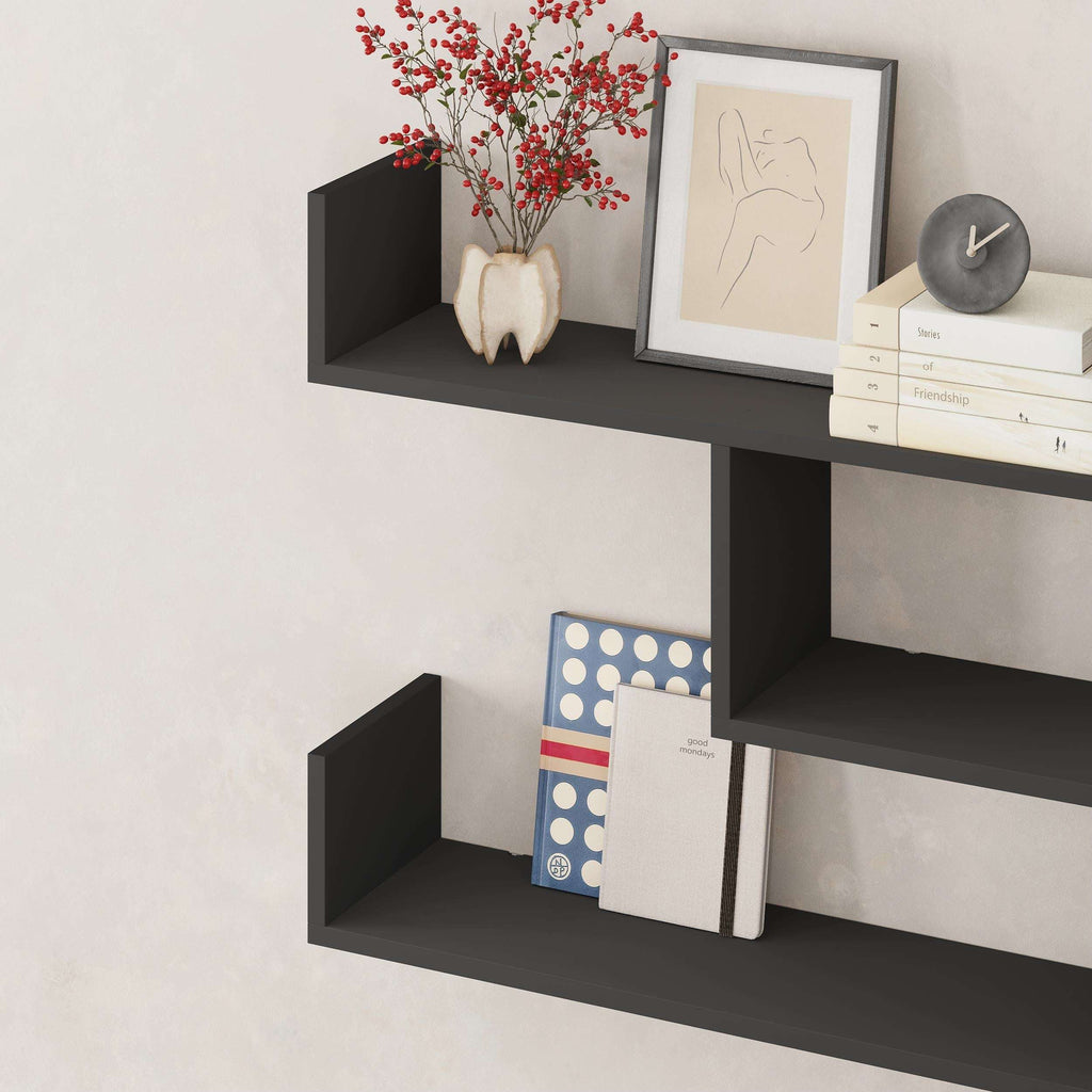 Wall-mounted floating shelf unit with three open cubbies in dark gray