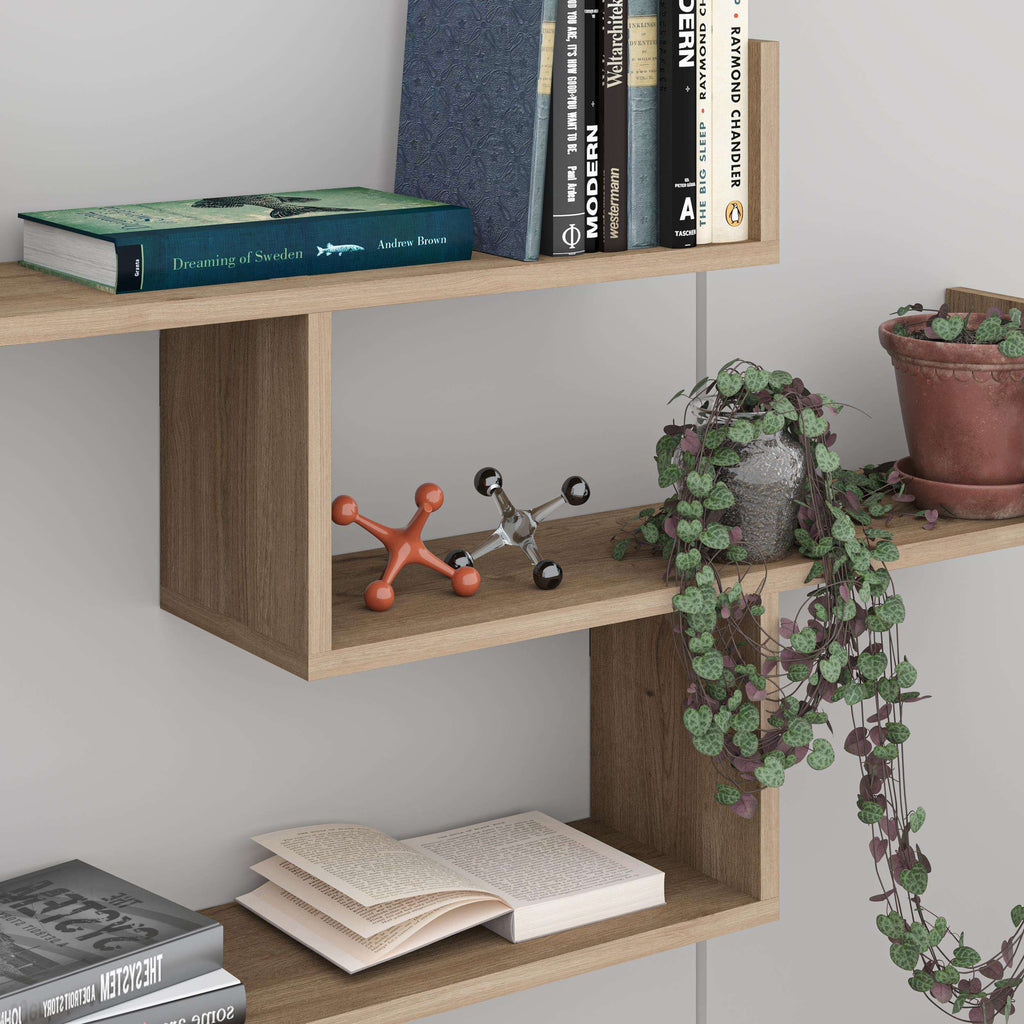 Black floating wall shelf unit with open cubbies and space for books