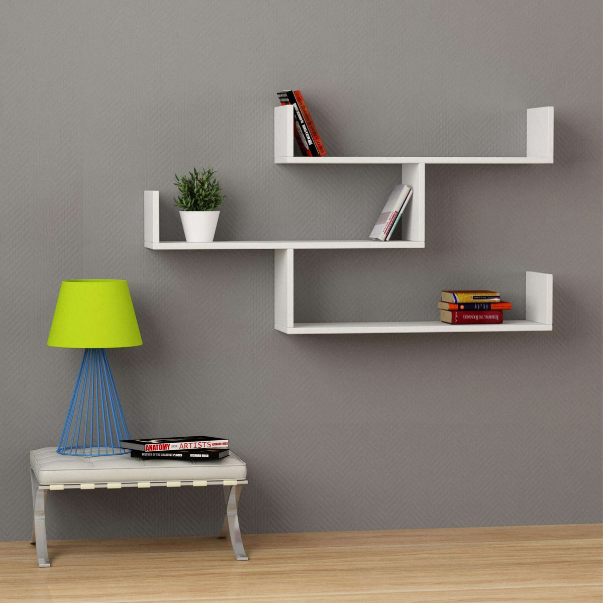 White floating wall bookcase shelf unit with three open compartments and vertical frame