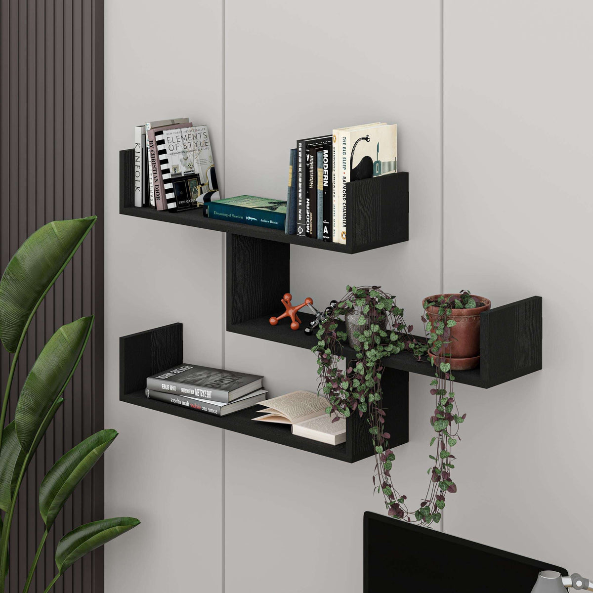 Floating wall bookcase with multiple open shelves in black and light oak, modern display