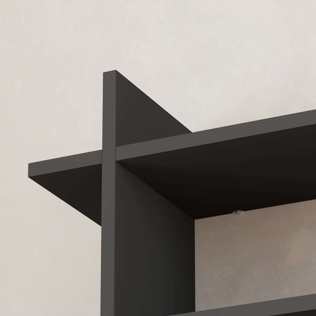 Close-up of dark wall bookcase corner with open shelf and side frame