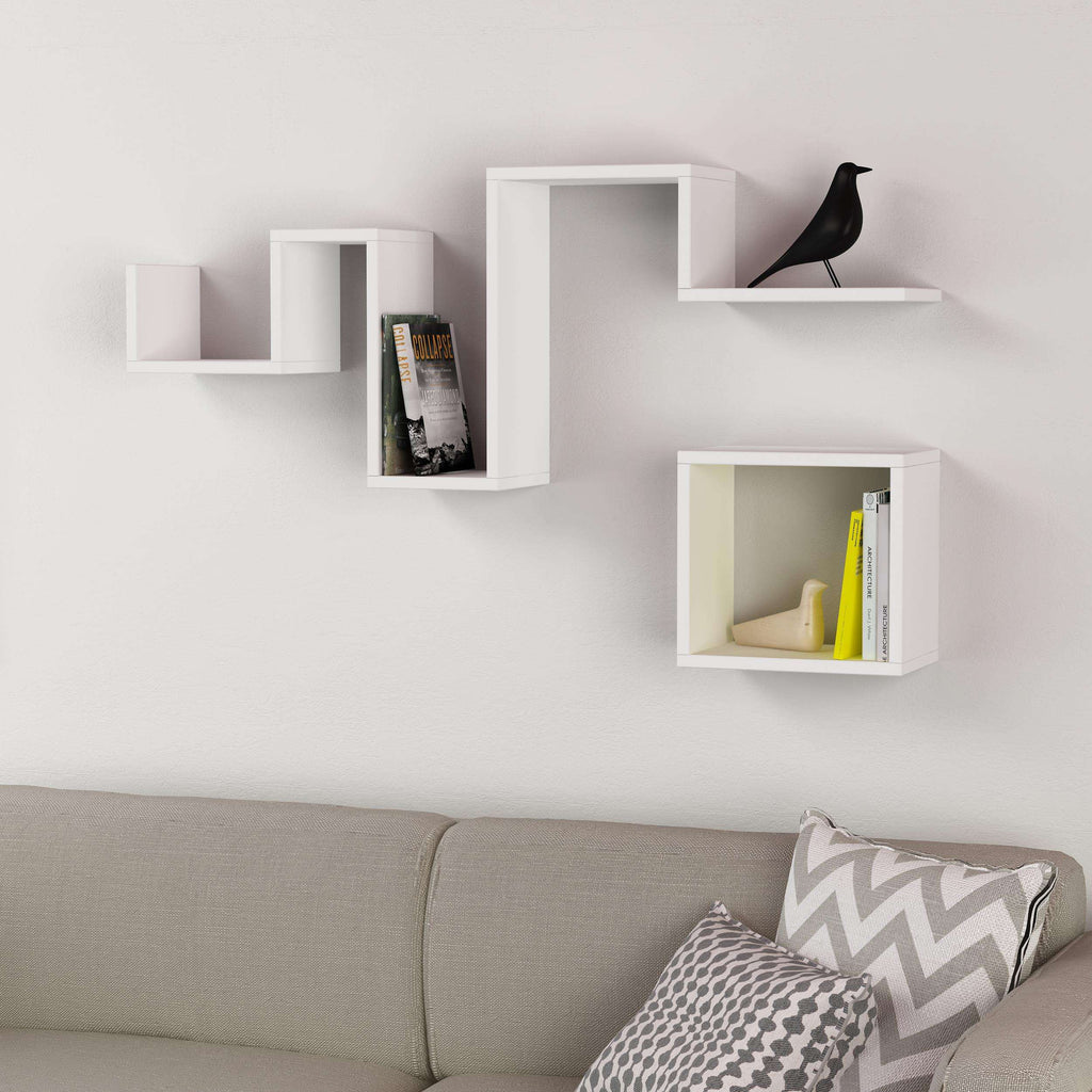 White floating wall shelf with three open sections and a long top ledge