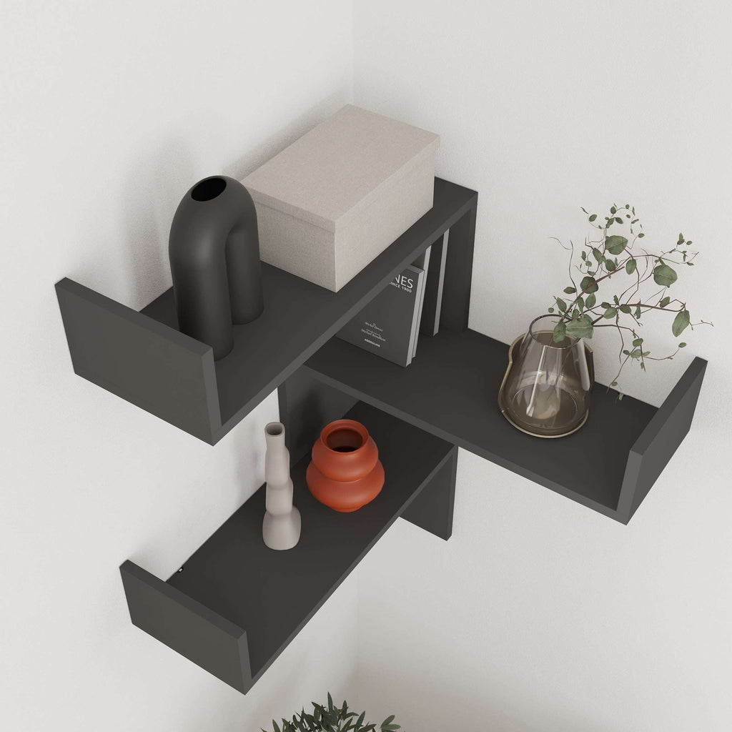 Dark gray corner wall-mounted bookcase with three open horizontal shelves