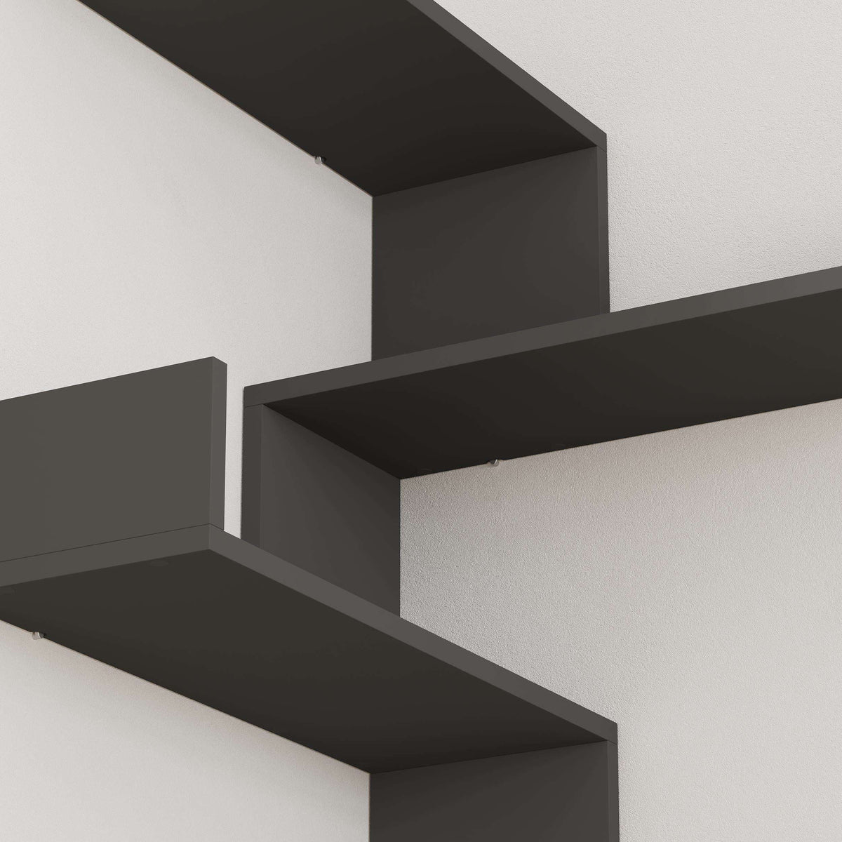 Close-up of anthracite wall-mounted bookcase shelves and ledge edges