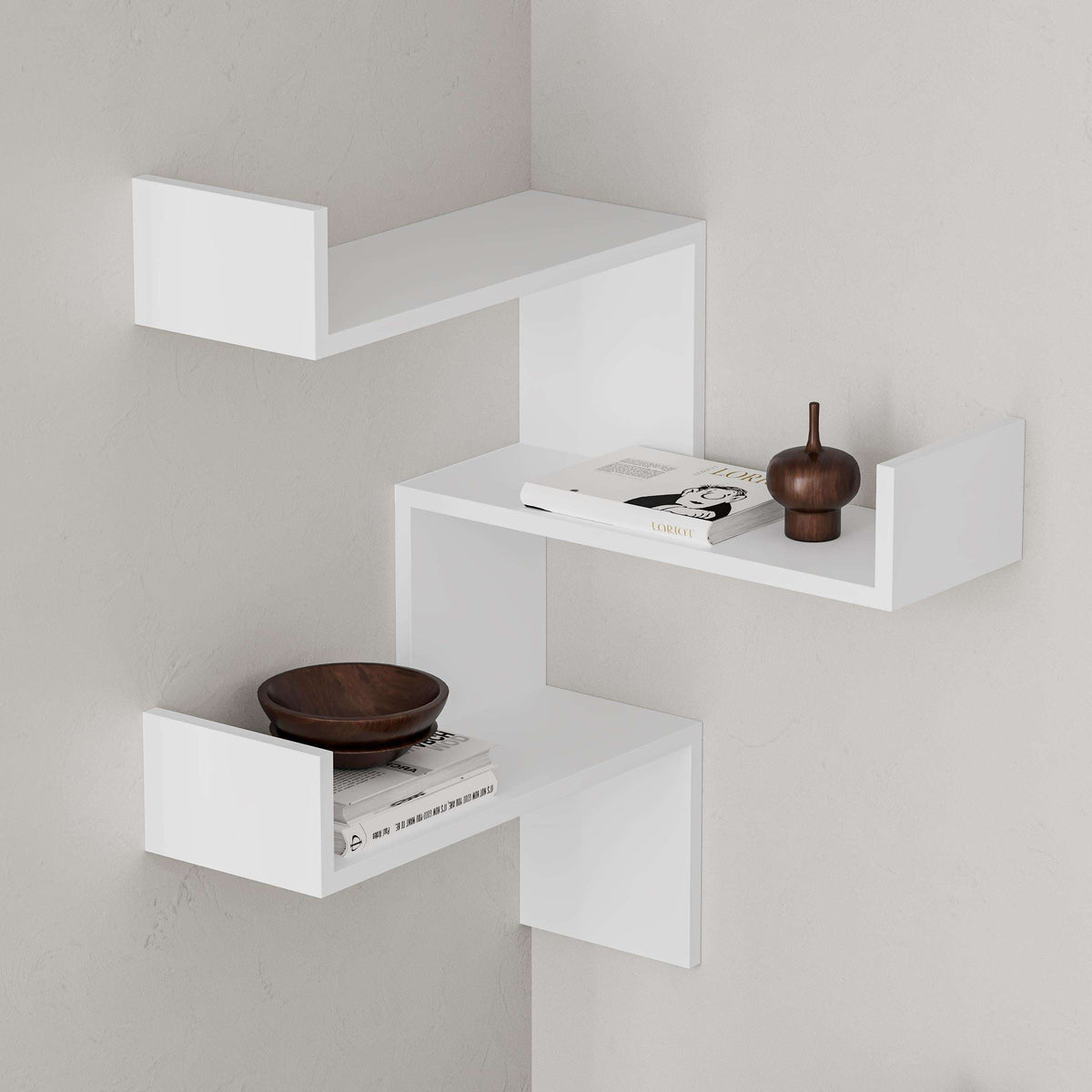 White corner wall bookcase with three open shelves and cubby compartments
