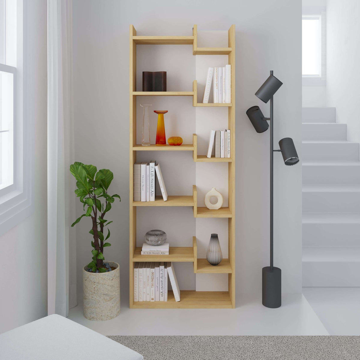 Tall bookcase display unit with open shelves and dark back panels, light wood