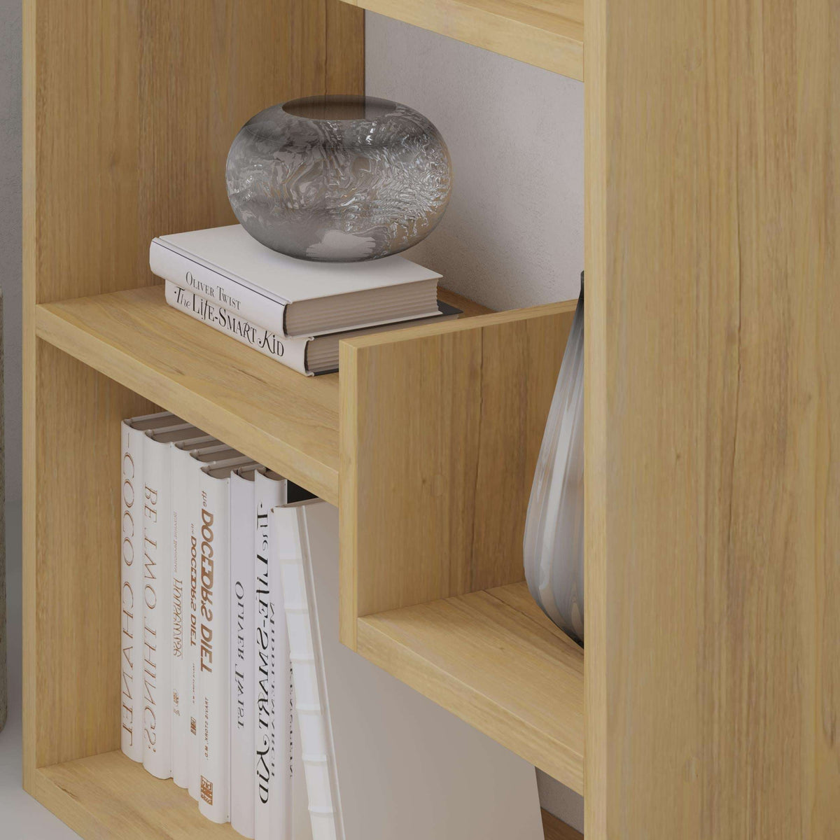Oak bookcase display unit shelf with books and a decorative gray vase