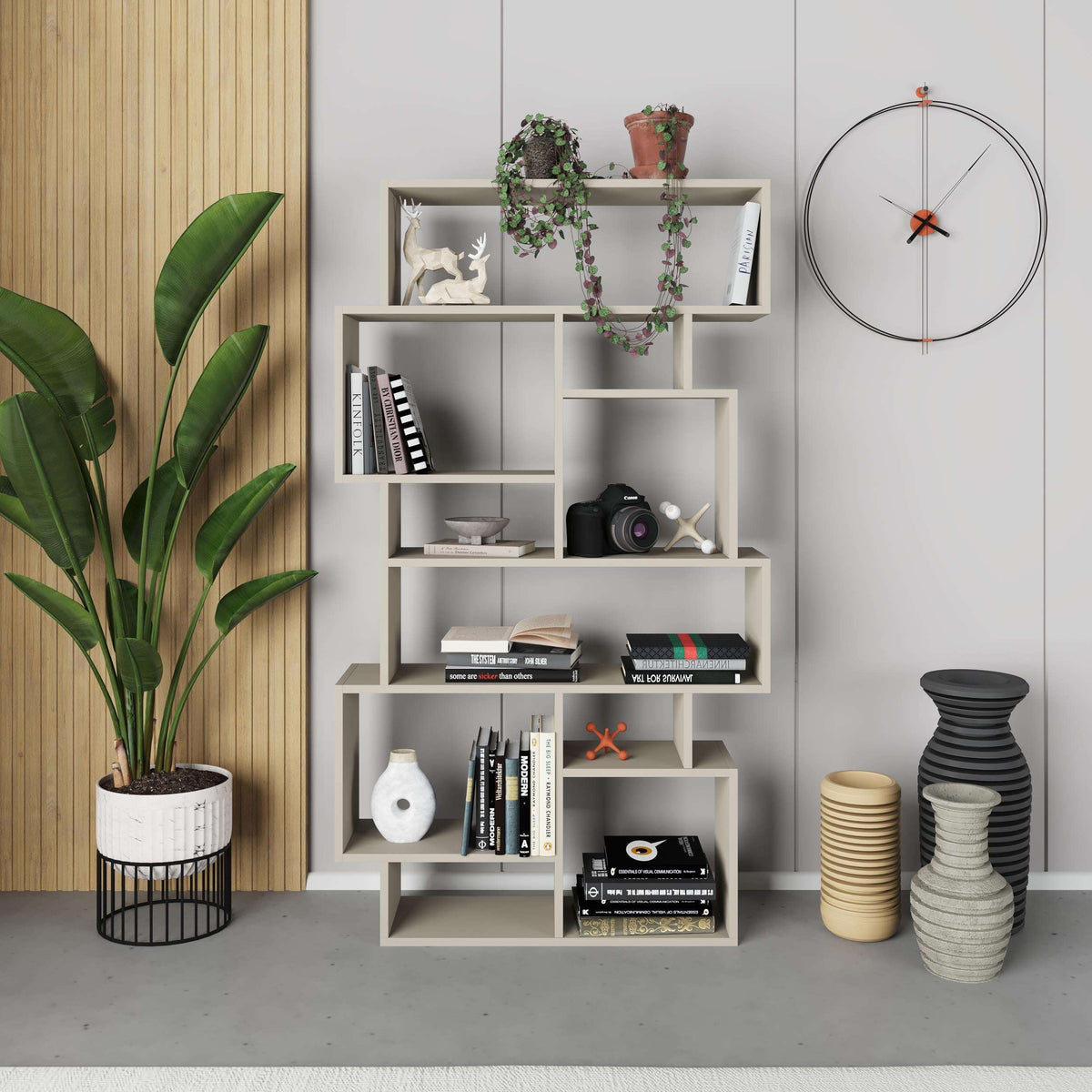 Tall modern bookcase with open shelves in white, styled with decor