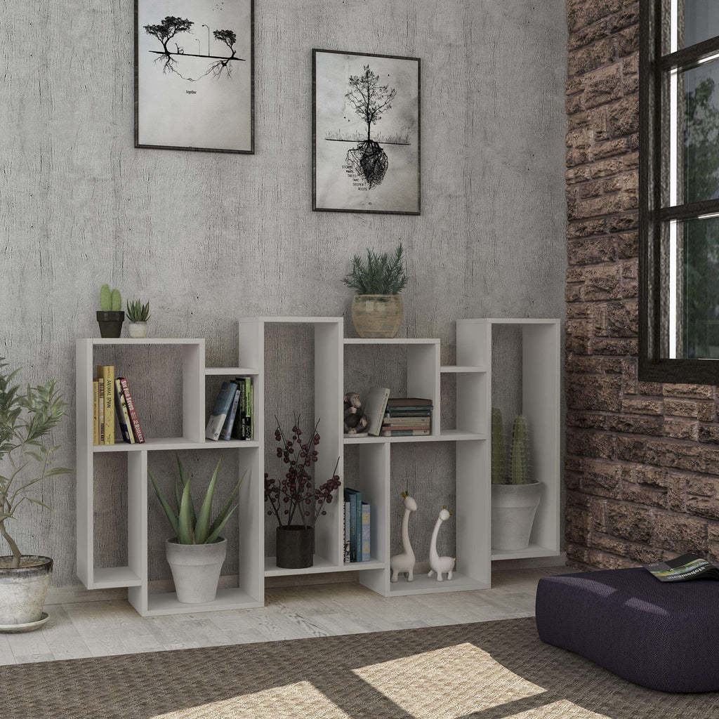 Tall white bookcase display unit with open compartments and center display cubbies