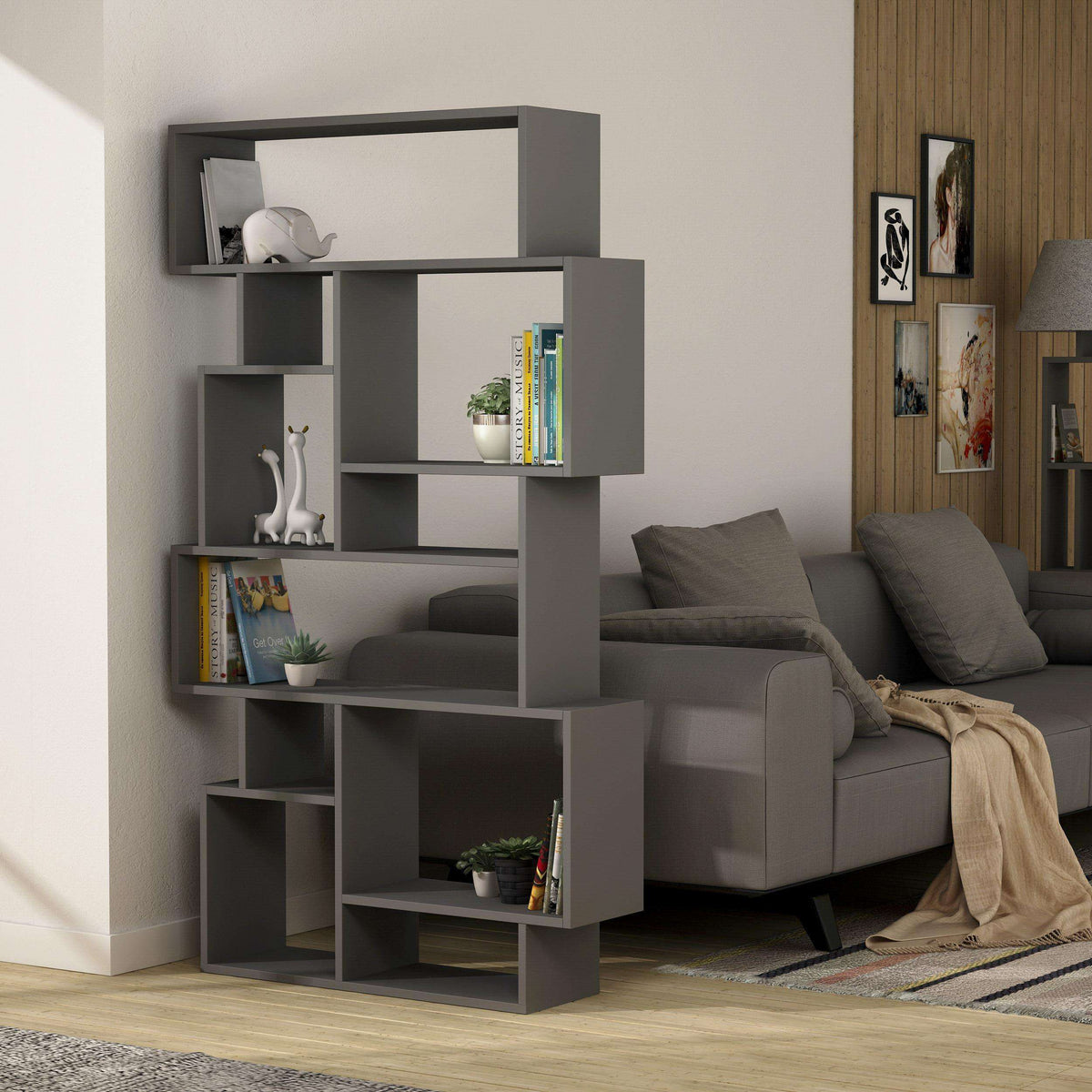 Tall grey bookcase display unit with open cubbies for books and small decor