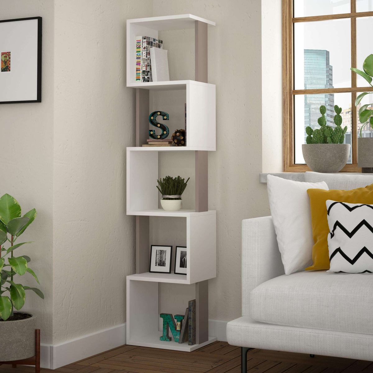 Tall modern bookcase display unit in light grey with open cubby shelves beside sofa
