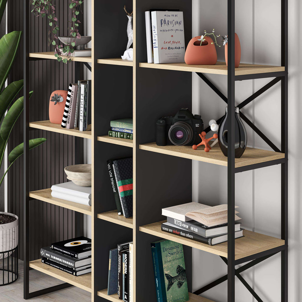 Close-up of oak shelves in a black bookcase shelving unit with open cubbies and braces