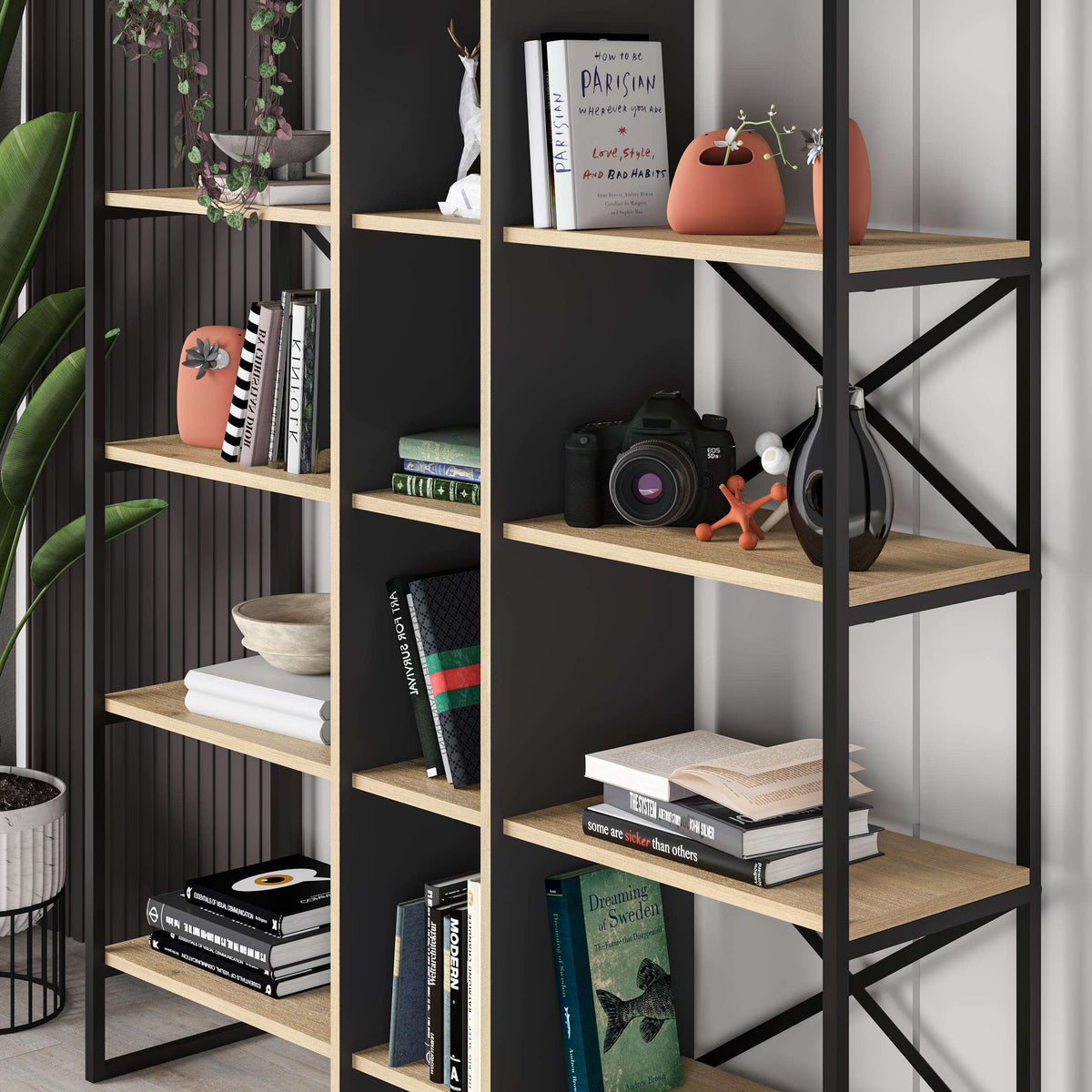 Close-up of oak shelves in a black bookcase shelving unit with open cubbies and braces