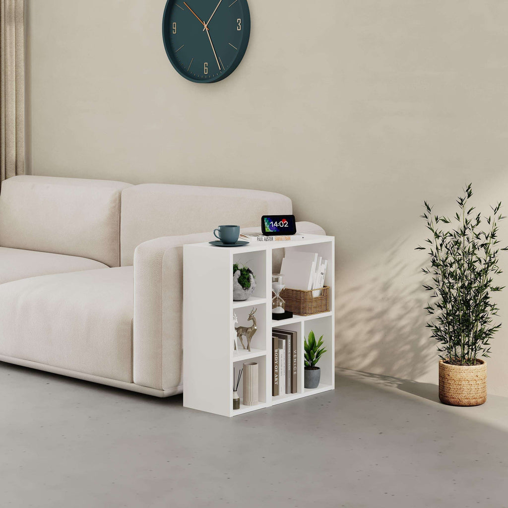 White low standing modular bookcase with open cubby shelves and top ledge, front view