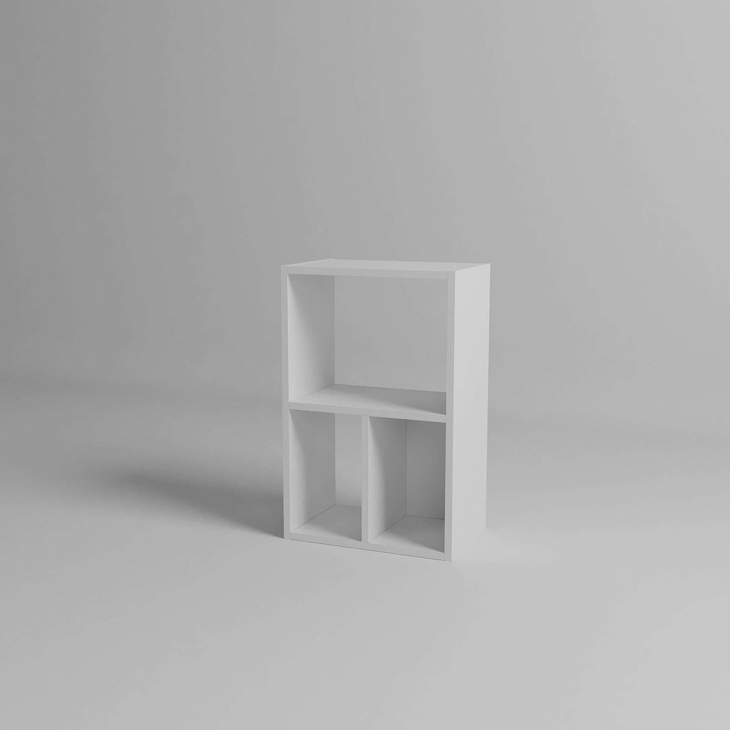 White modular low standing bookcase with three open cubby sections