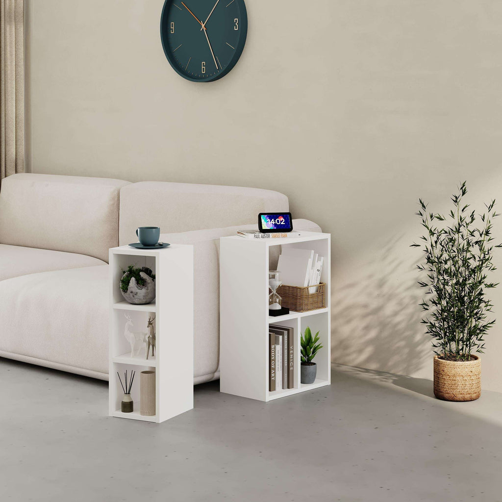 White modular low bookcase set with open cubby shelves, styled with decor