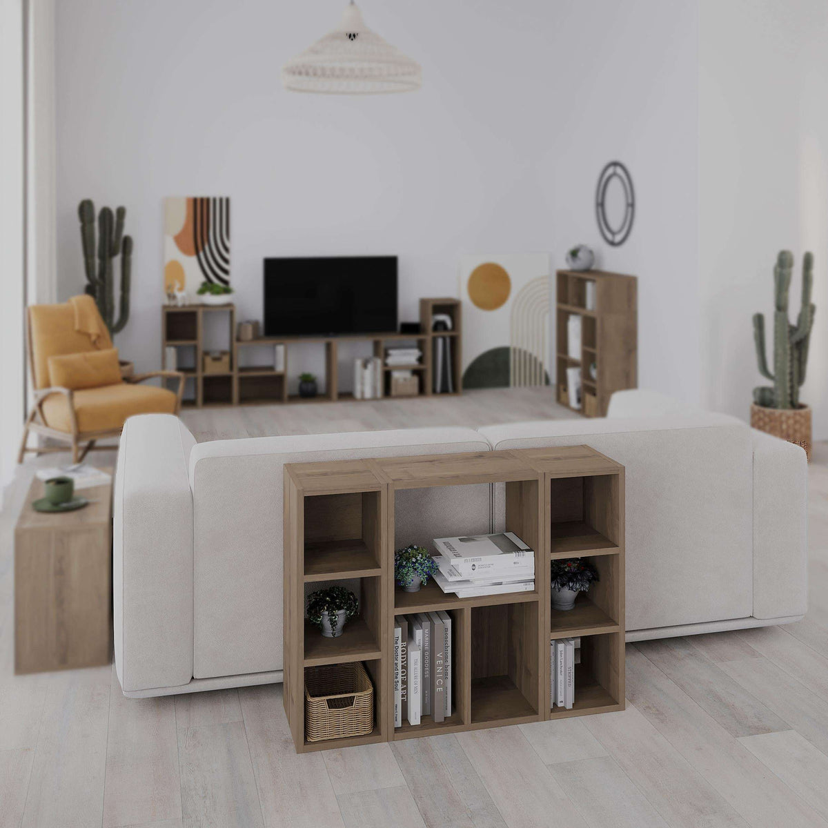 Open cube bookcase in light wood with cubbies holding books and small items