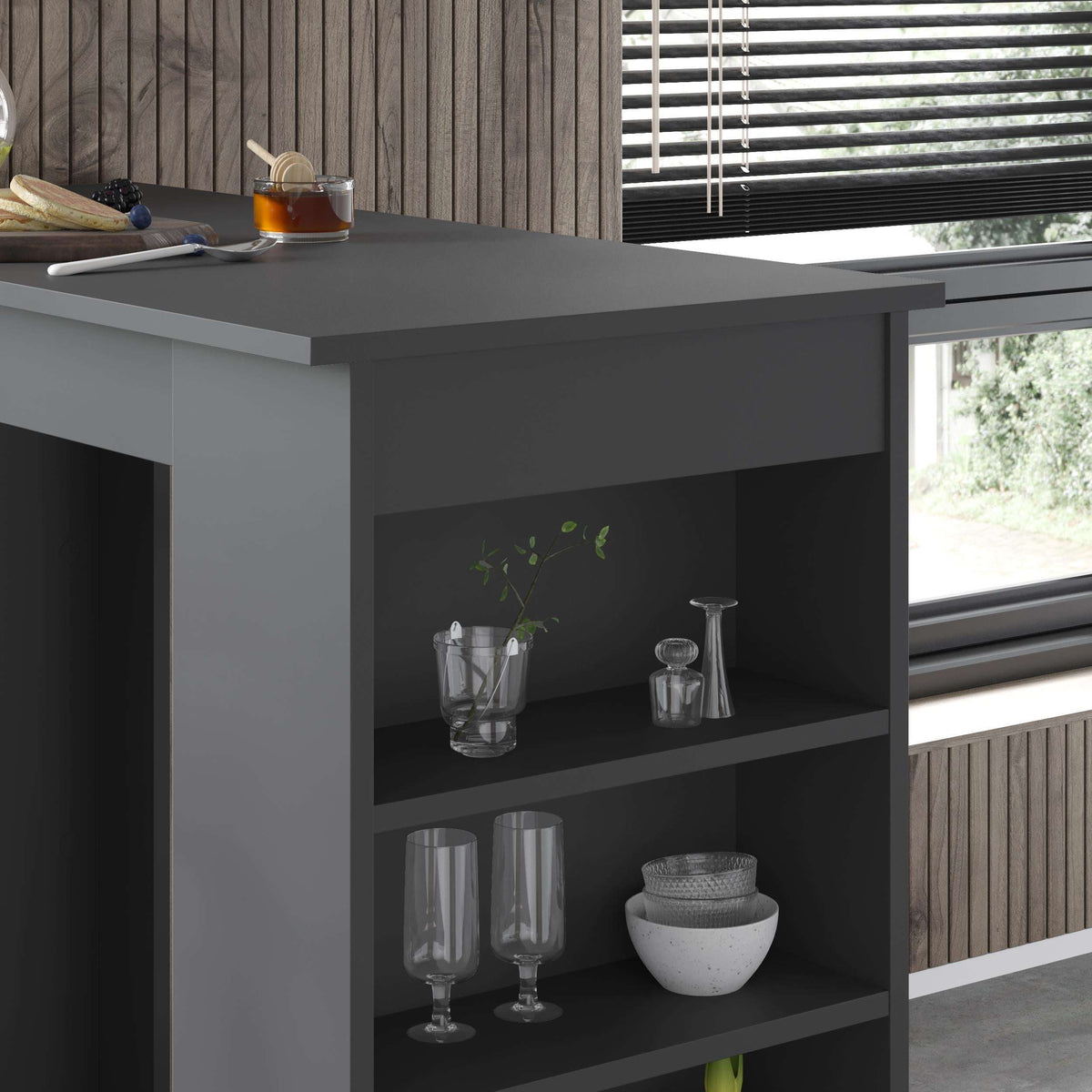Anthracite bar table storage shelf unit with glassware and decorative items on tiers
