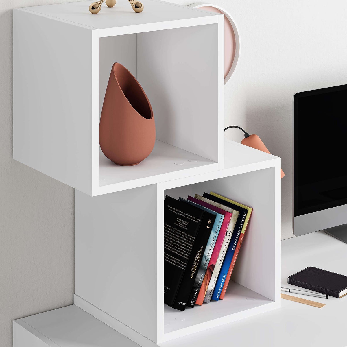 White cube-shelf desk with open storage compartments and tabletop for a workspace.