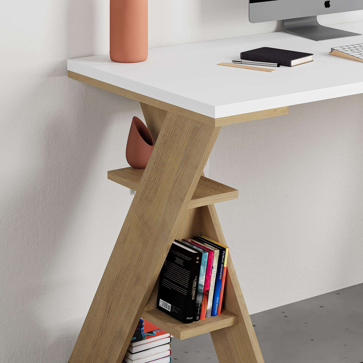 Corner view of modern desk with white top and light oak bookshelf leg with shelves