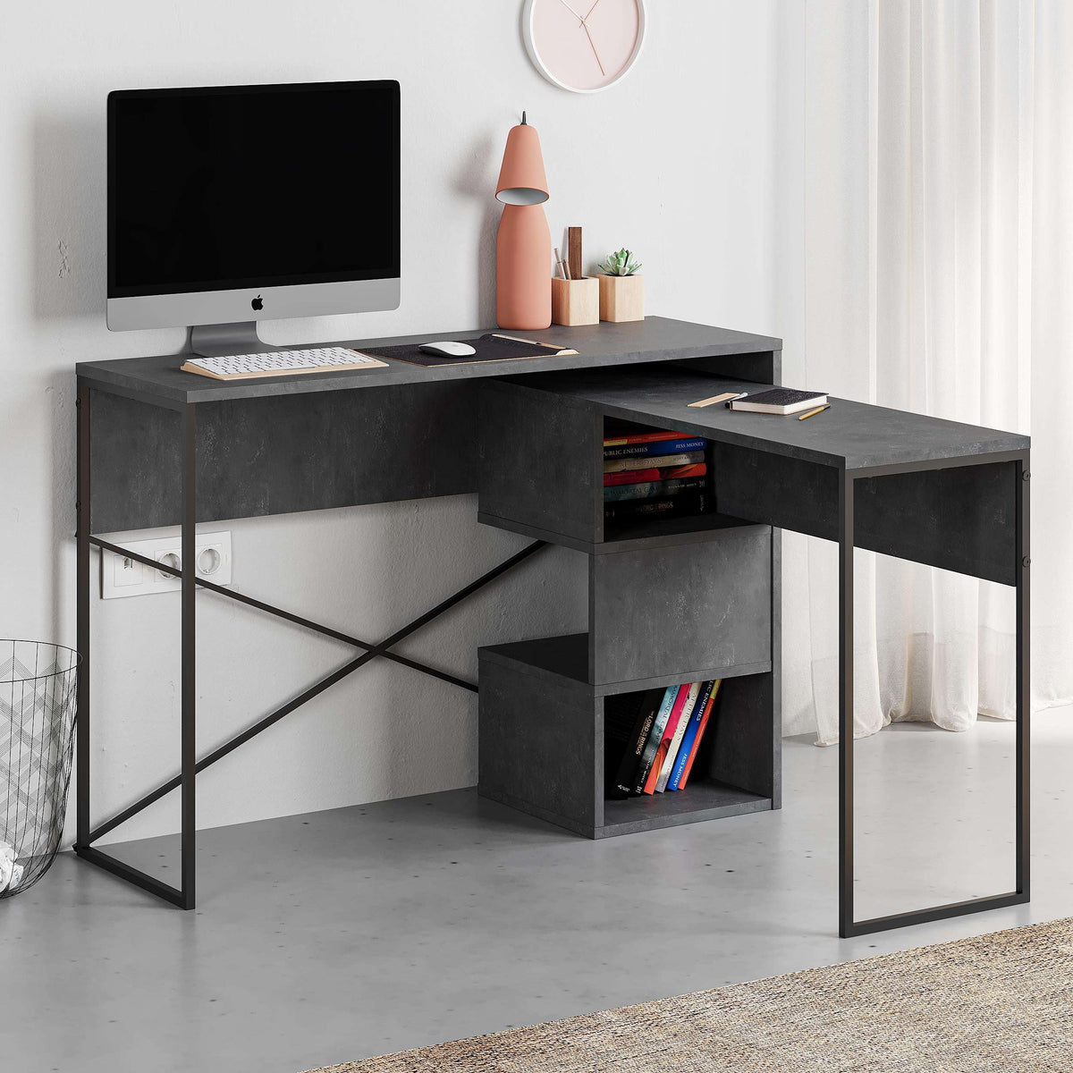 Dark gray corner desk with open cubby shelf and book storage on the side