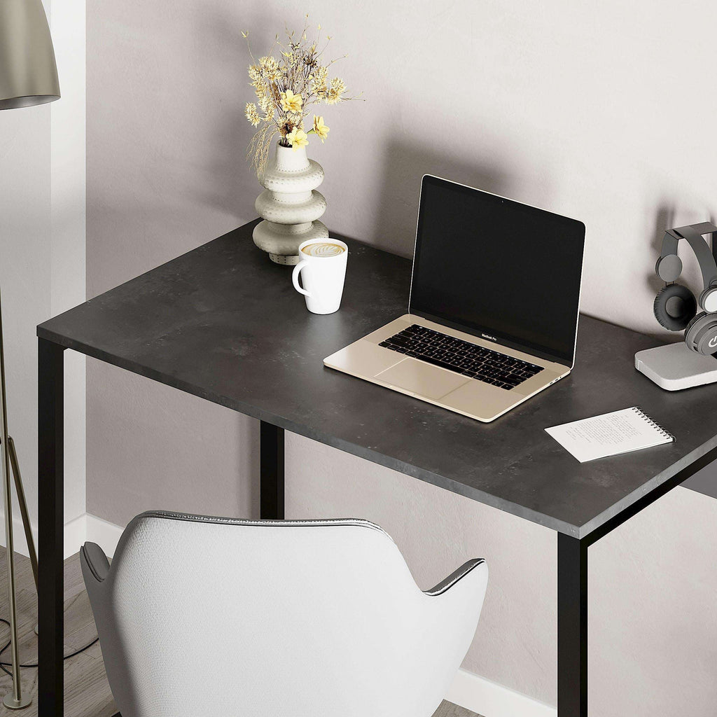 Modern working table with dark gray top and black metal legs