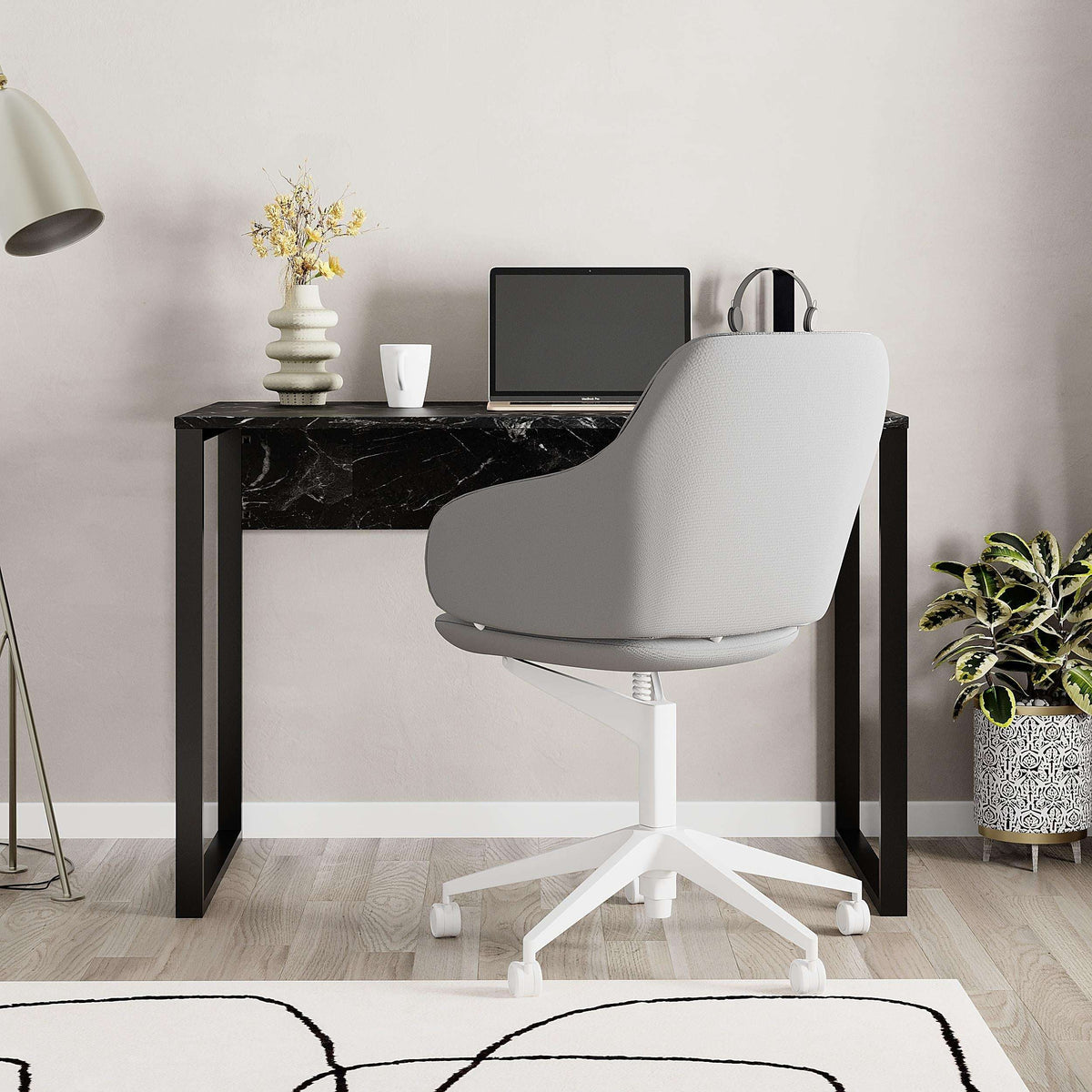 Modern desk with black marble-look tabletop and black metal legs