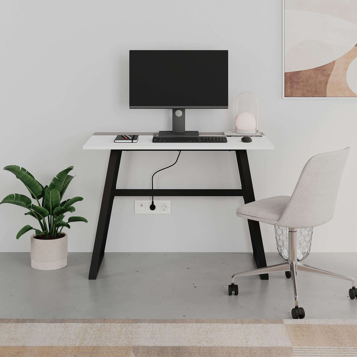 White study desk with monitor setup, dark legs, and grey swivel office chair