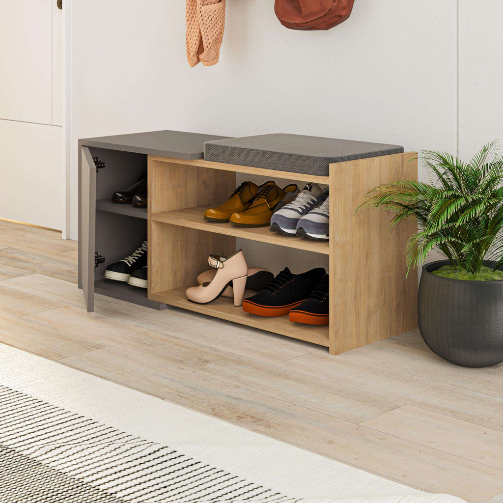 Oak shoe storage bench with gray side panel, open cubbies, and shoes on shelves