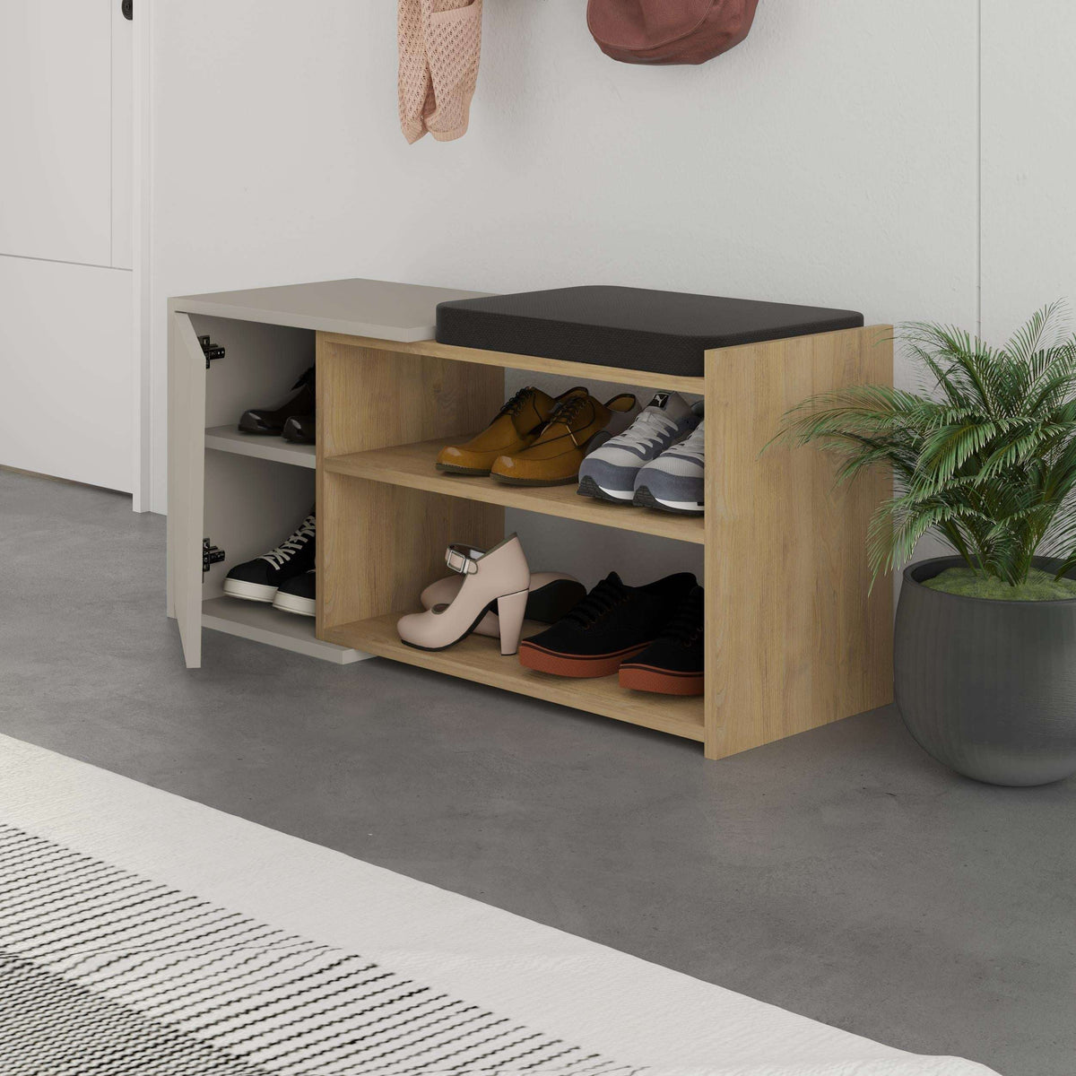 Shoe storage bench with hinged lid, open compartments showing shoes, oak and sandstone finish