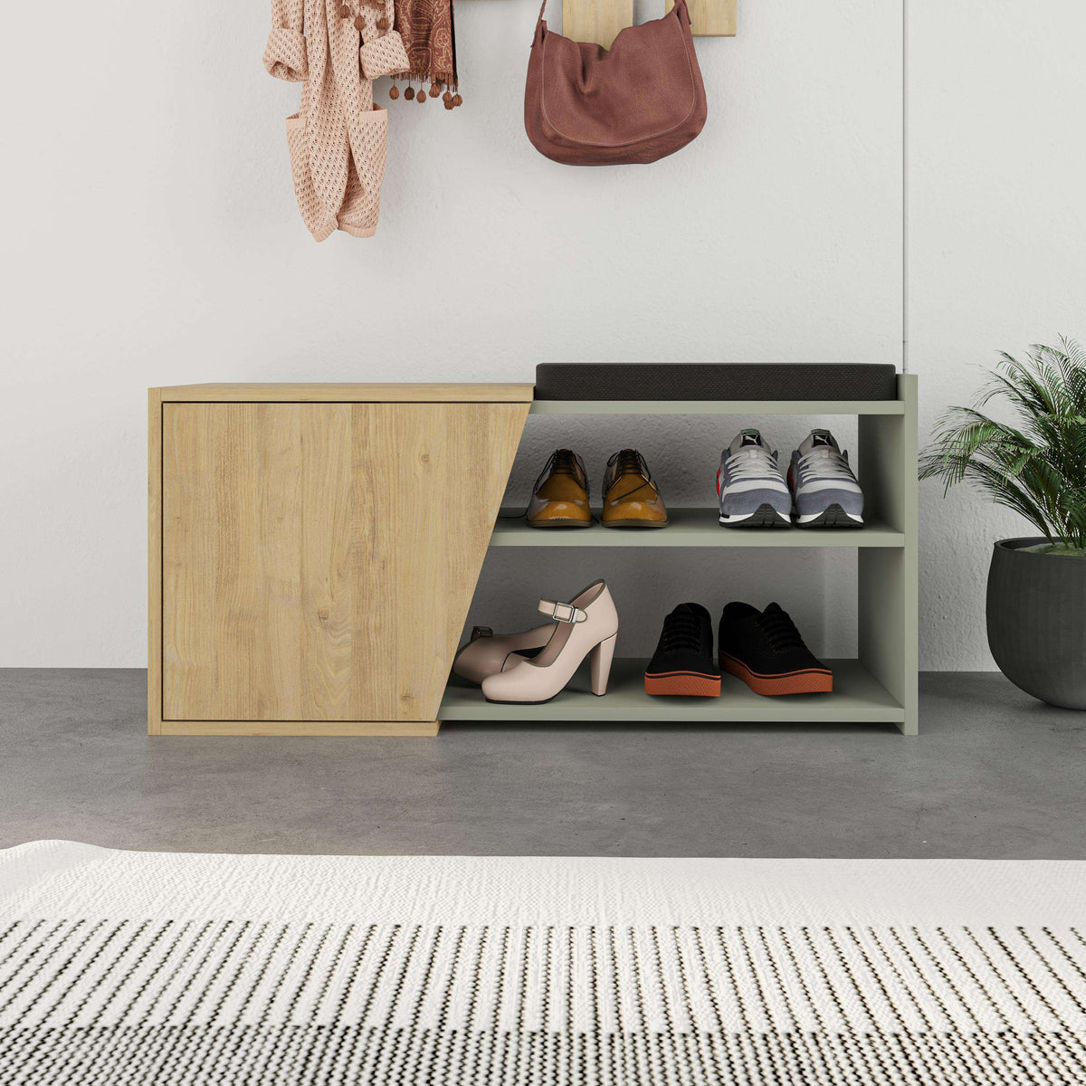 Shoe storage bench with open shelves, black cushion, oak cabinet door, gray interior and shoes