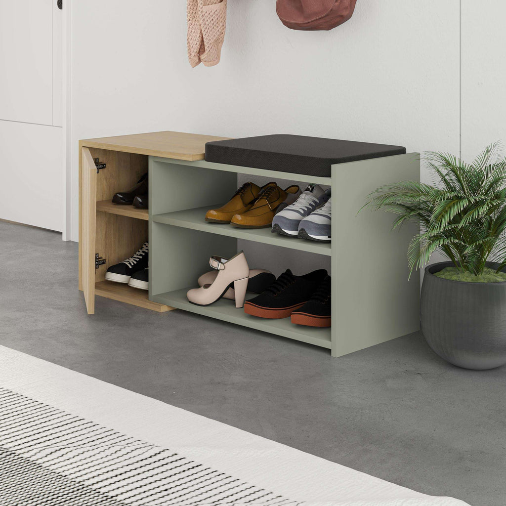 Shoe storage bench with hinged lid, black cushion top, open shelves with shoes, gray interior