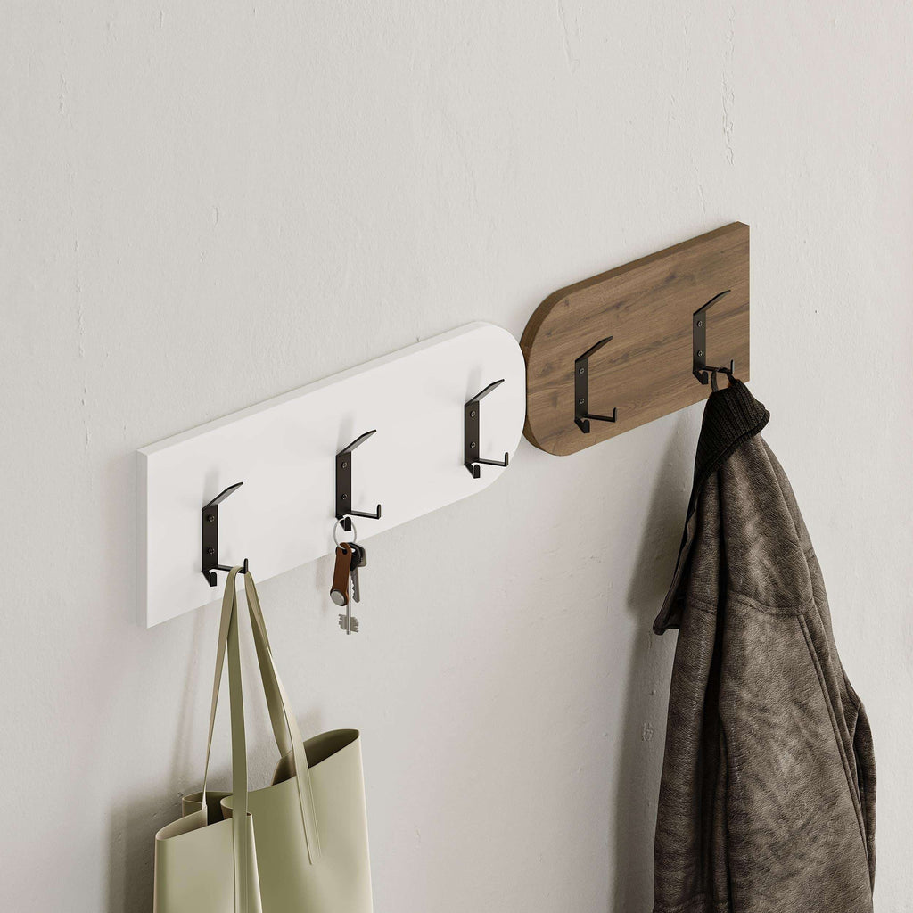Wall coat hanger bar with hooks for coats and bags; partial shoe cabinet top visible