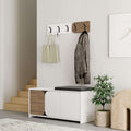 Hallway shoe cabinet with coat hooks, black top cushion, white doors, wood side panels